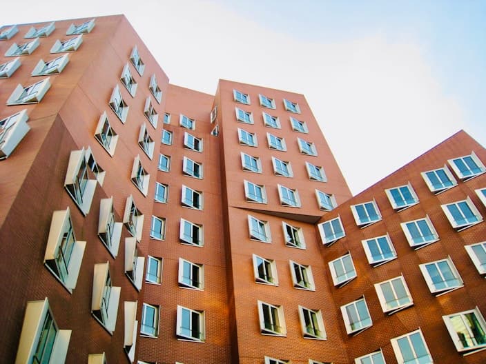 CMC garden apartment building with landscaped entrance